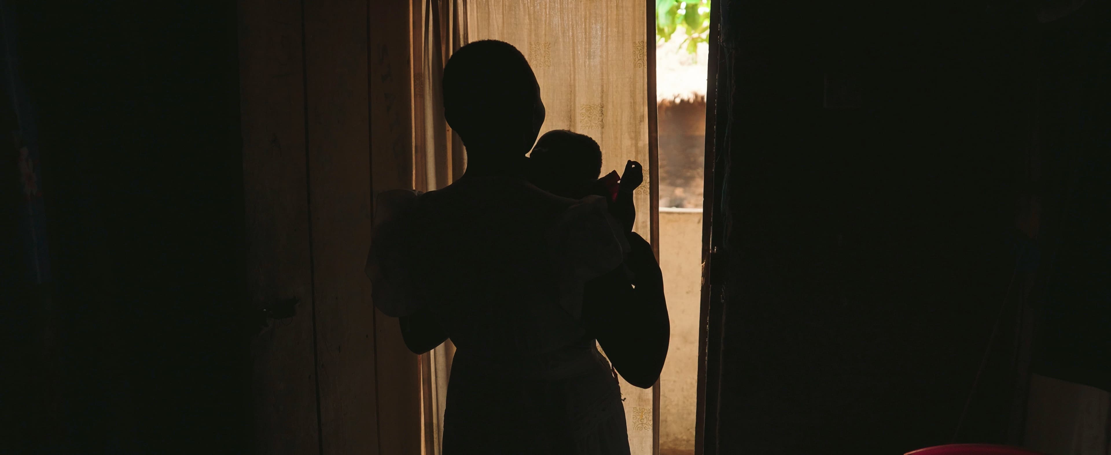 Silhouette of a woman in a doorway, Ghana